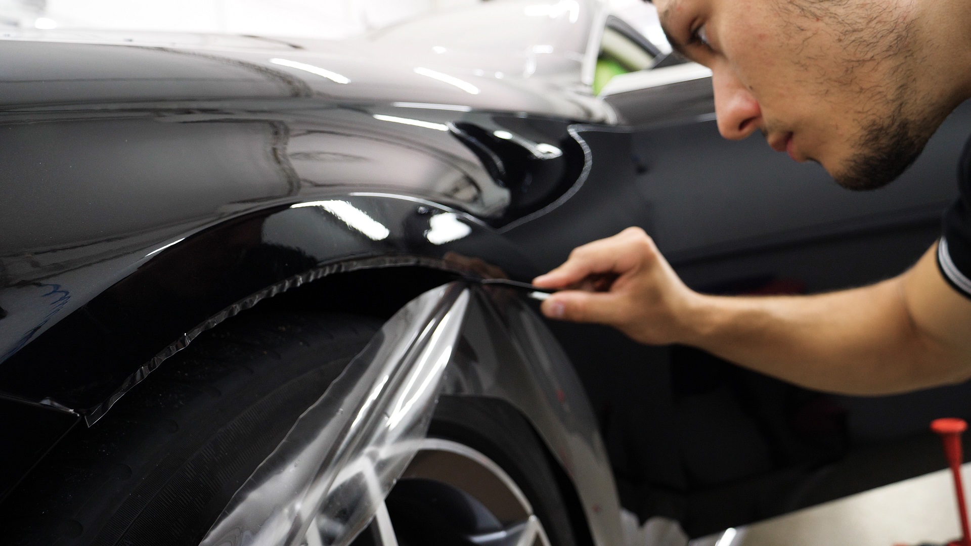 Close,Up,To,Ppf,Installation,Process,On,A,Front,Headlight